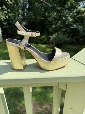 Gold platform heeled sandal with ankle strap